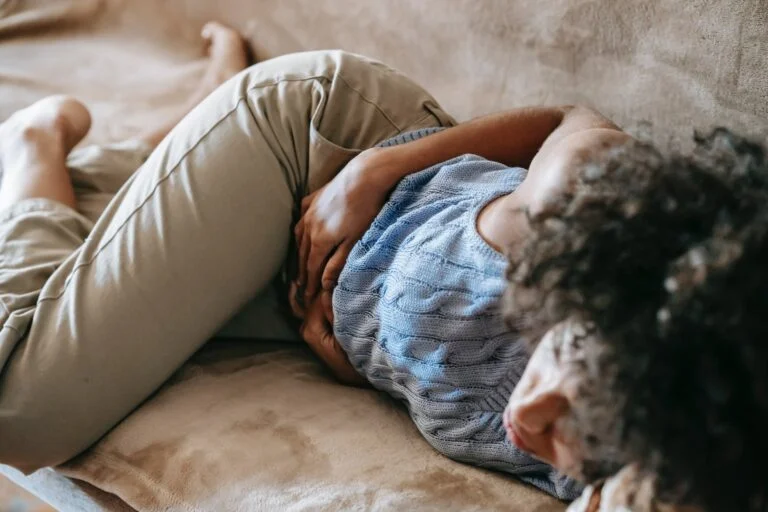 woman suffering from a stomach pain